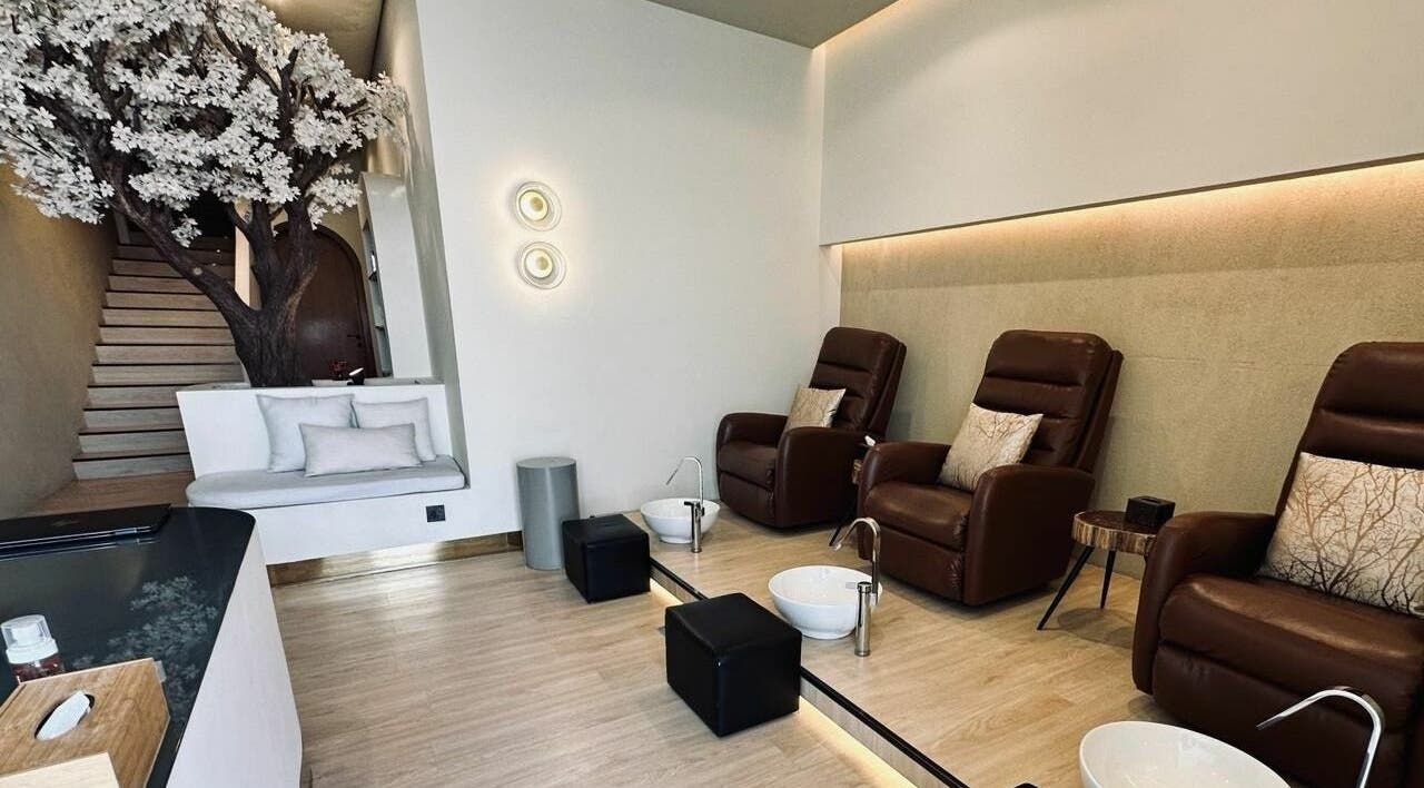 Luxurious pedicure chairs and serene decor at Anotha Beauty Salon, Dubai, AE, offering ultimate relaxation.