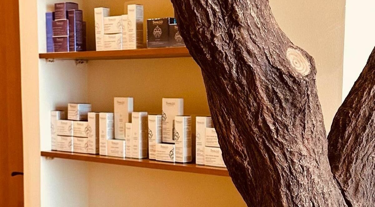 Relaxing interior of Anotha Beauty Salon, Dubai, AE, with skincare products elegantly displayed on shelves.