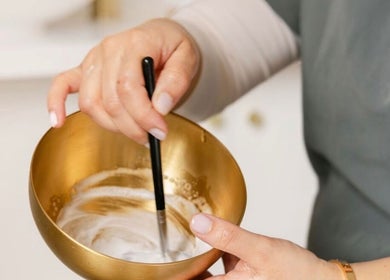 Mixing a beauty treatment at The Remedi Room, Wolverhampton, England, GB for personalized wellness care.