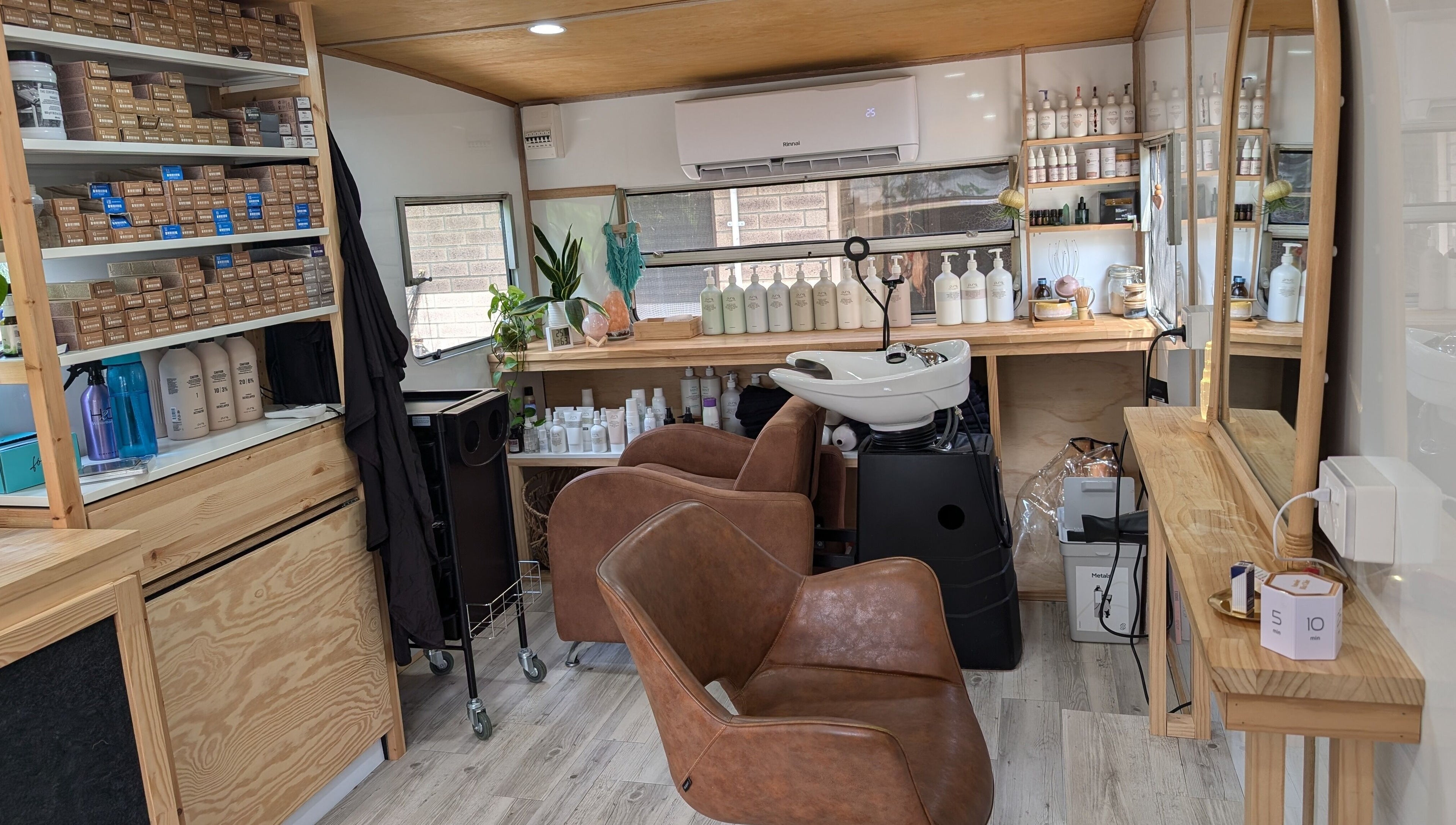 Hair studio interior at Hair NV by Jade in Heathridge, Western Australia, AU featuring chairs and hair products.
