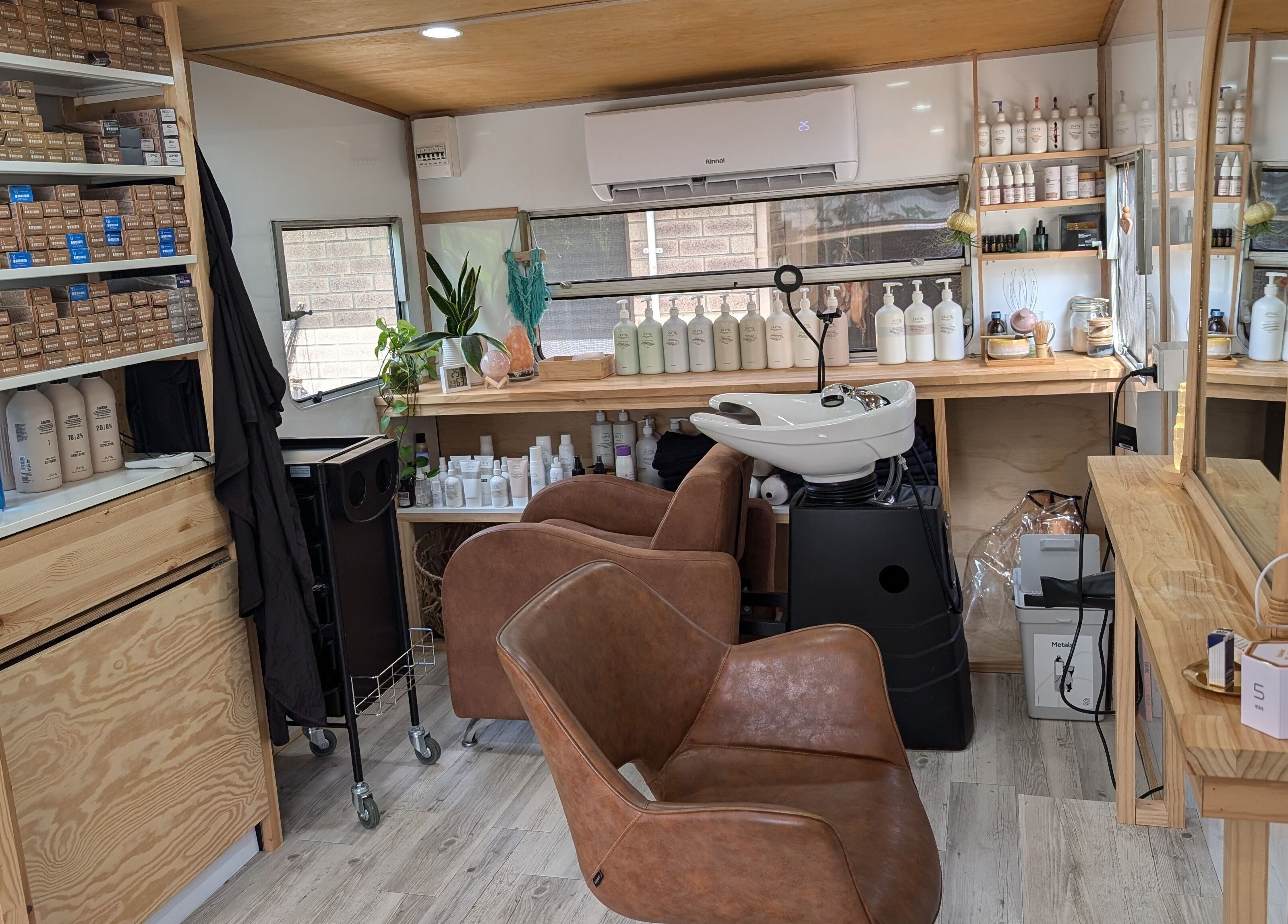 Hair studio interior at Hair NV by Jade in Heathridge, Western Australia, AU featuring chairs and hair products.