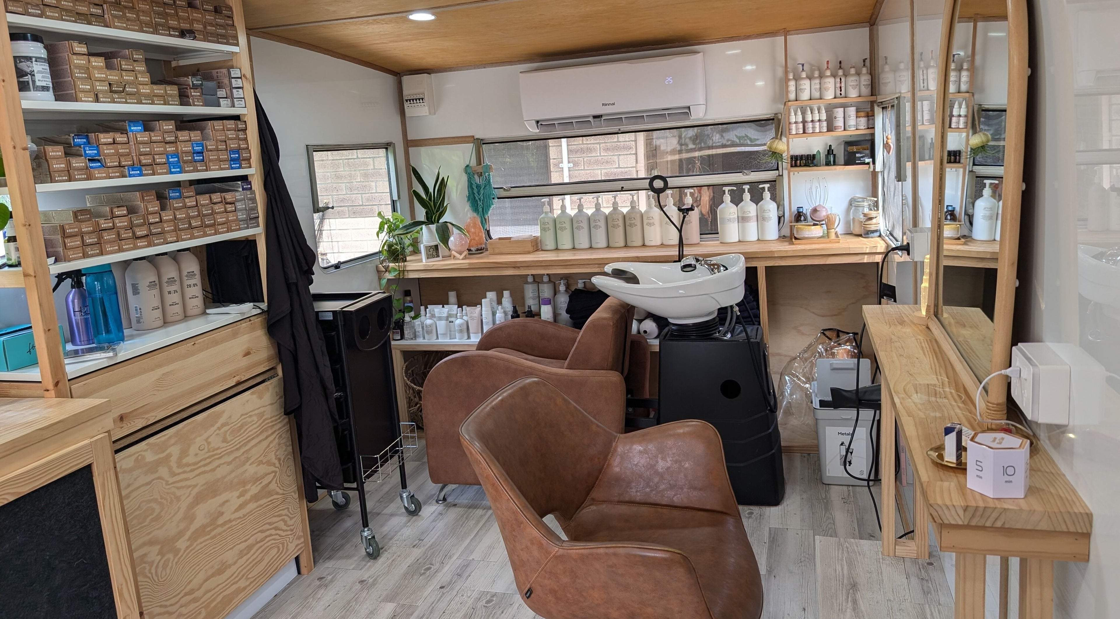 Hair studio interior at Hair NV by Jade in Heathridge, Western Australia, AU featuring chairs and hair products.