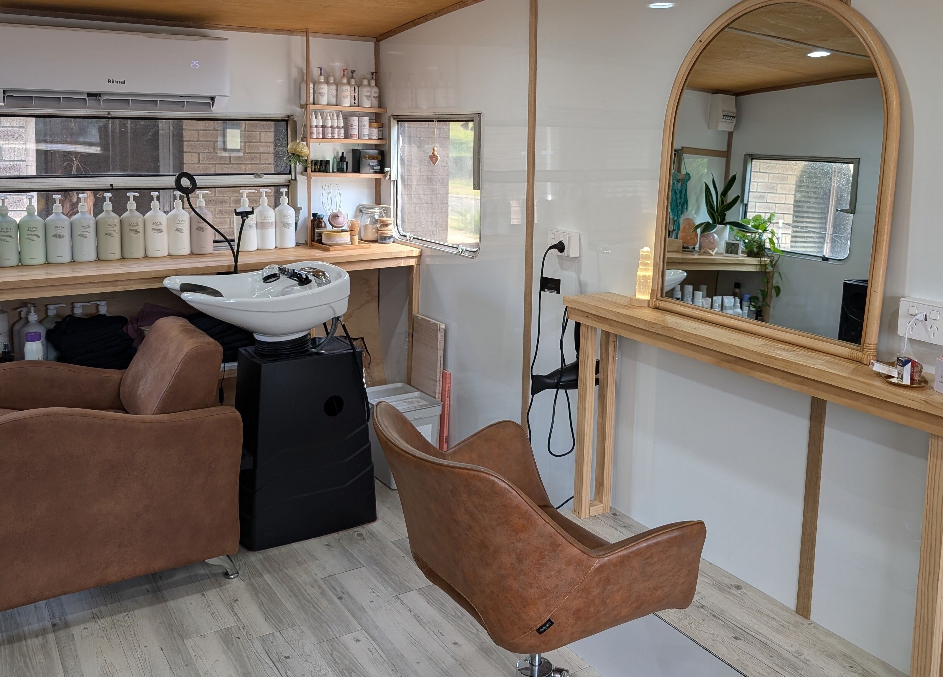 Modern salon interior at Hair NV by Jade, Heathridge, Western Australia, AU, featuring stylish chairs and decor.