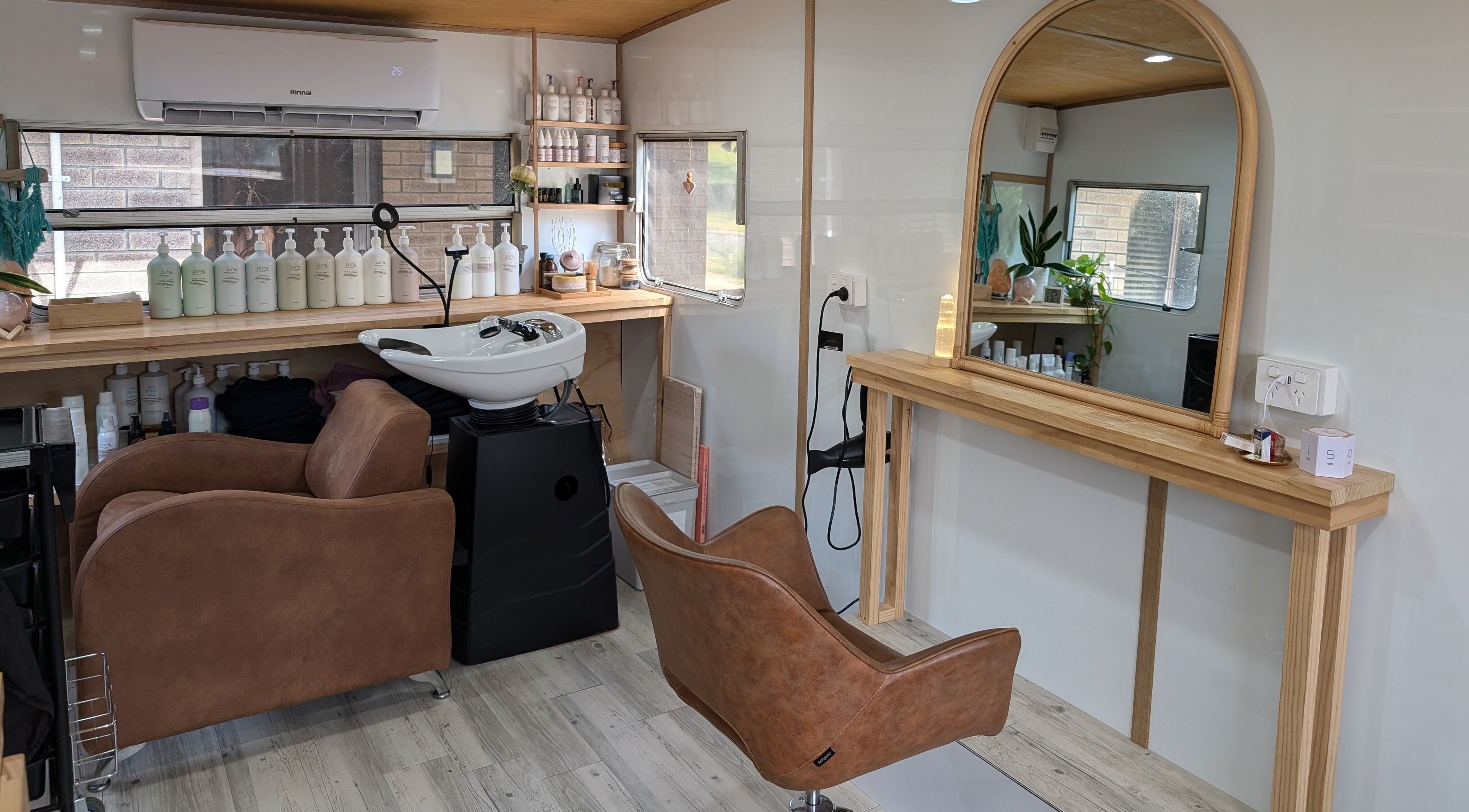 Modern salon interior at Hair NV by Jade, Heathridge, Western Australia, AU, featuring stylish chairs and decor.