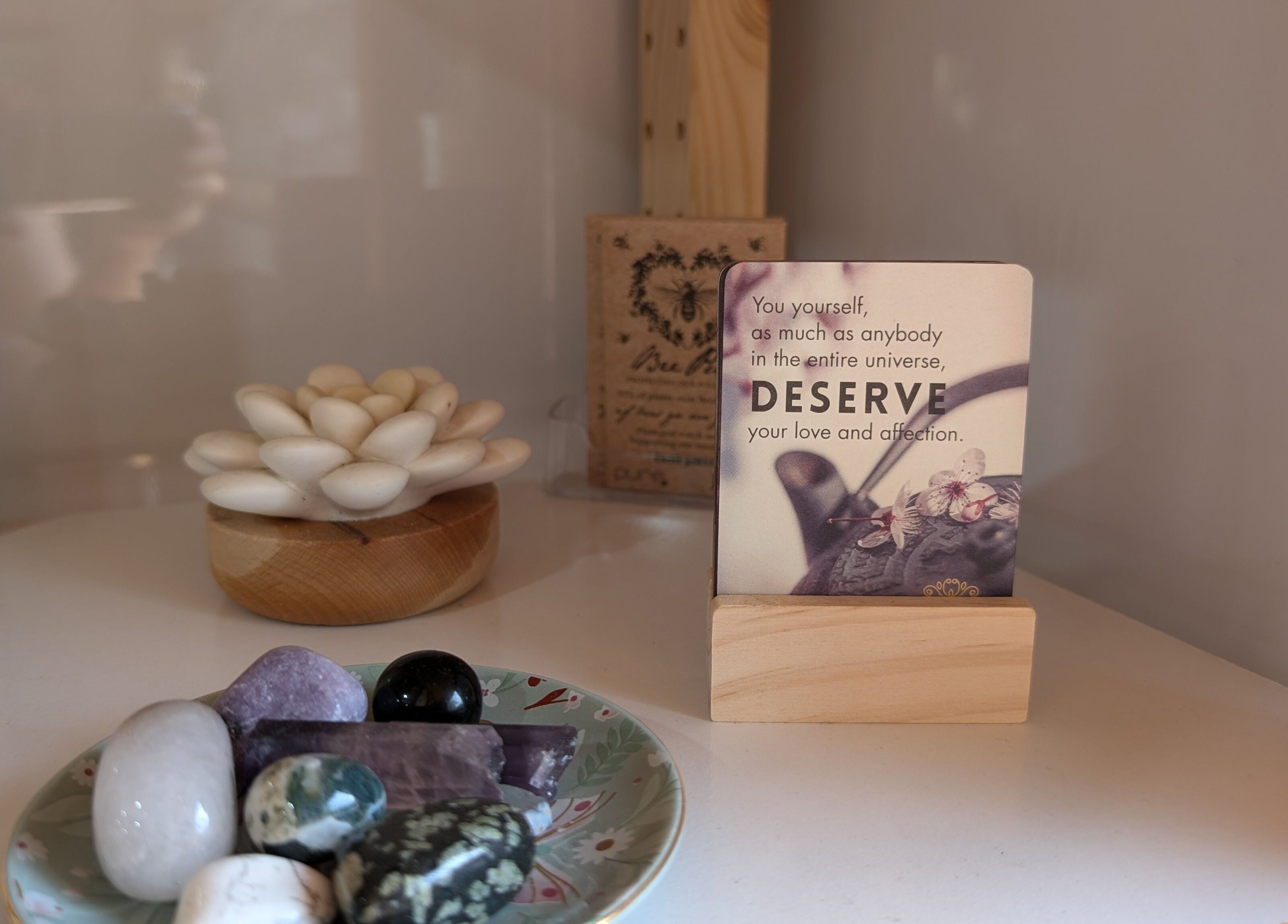 Tranquil decor featuring crystals and a motivational card at Hair NV by Jade, Heathridge, Western Australia, AU.