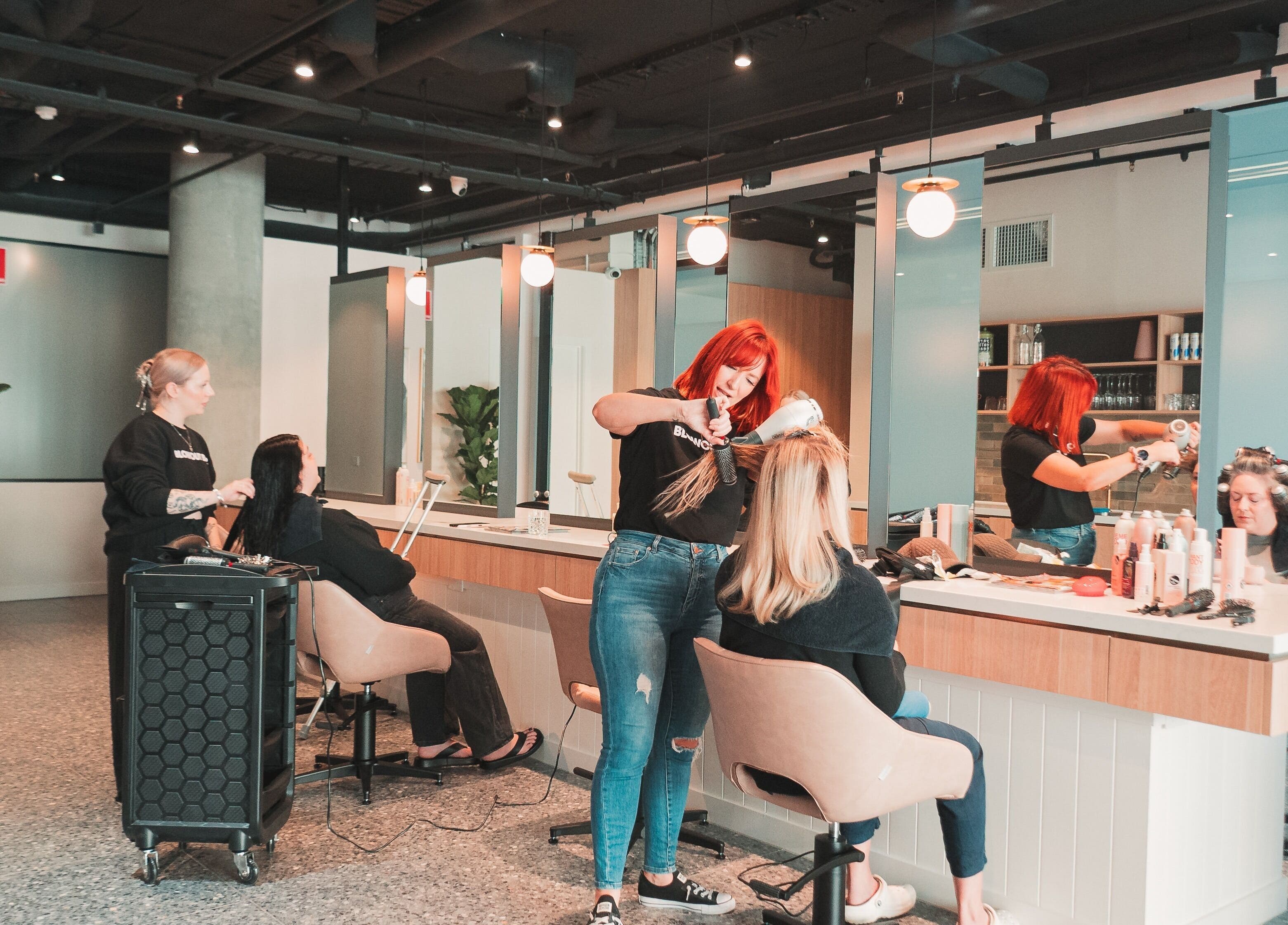 Stylists at work in The Blowout Bar - Brighton, located in Brighton, Victoria, AU, creating stunning hairstyles.