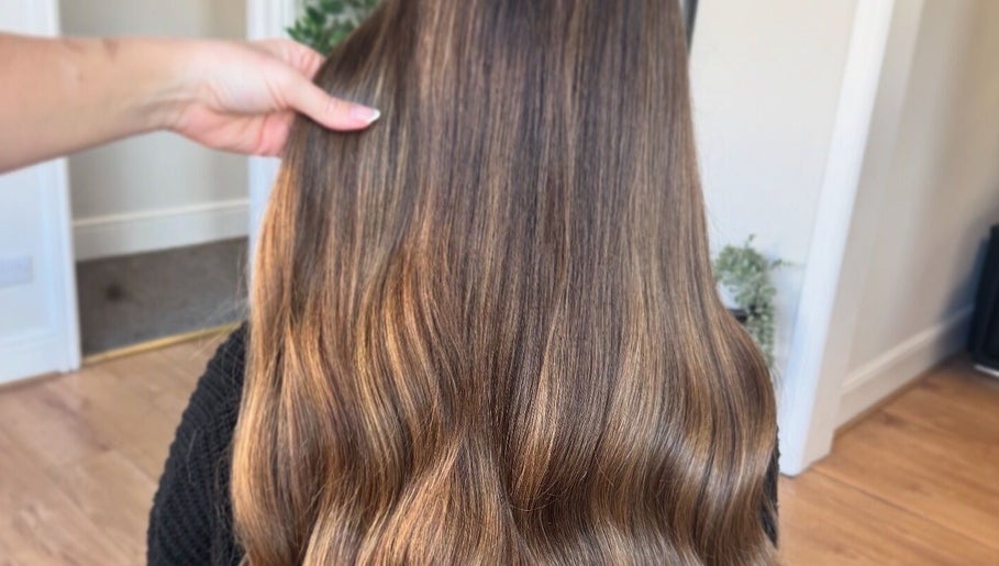 Smooth, shiny brown hair styled at DE Hair & Aesthetics, Kingsteignton, England, GB.