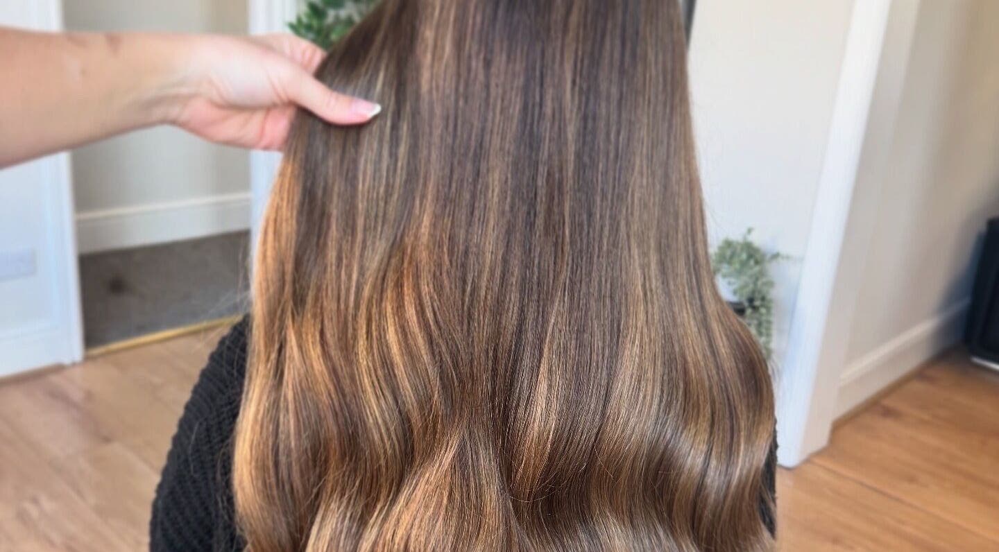 Glossy brown hair styled at DE Hair & Aesthetics, Kingsteignton, England, GB.