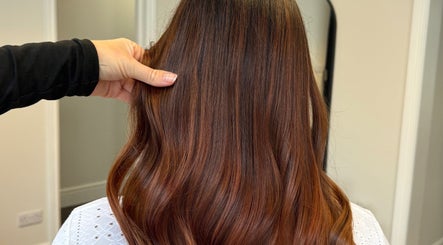 Shiny brunette waves styled at DE Hair & Aesthetics, Kingsteignton, England, GB. Luxurious salon finish.