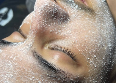 Face exfoliation treatment at Live Lovely Esthetics, Richardson, Texas, US, showcasing glowing skin.