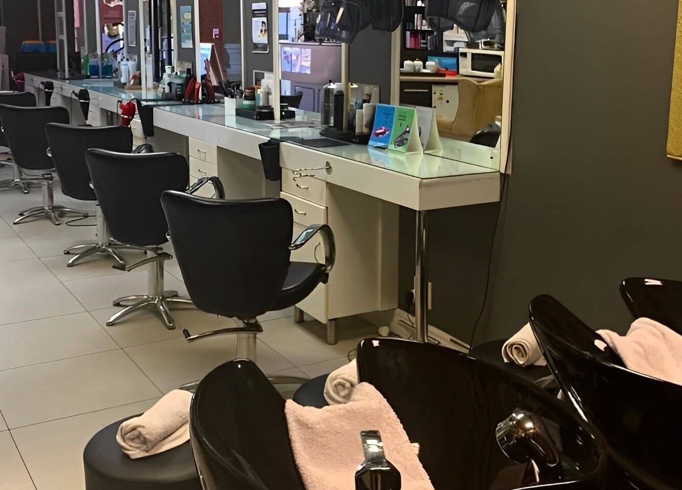 Chic interior of Arriba Salon in Cape Town, Western Cape, ZA. Elegant styling chairs and stations.