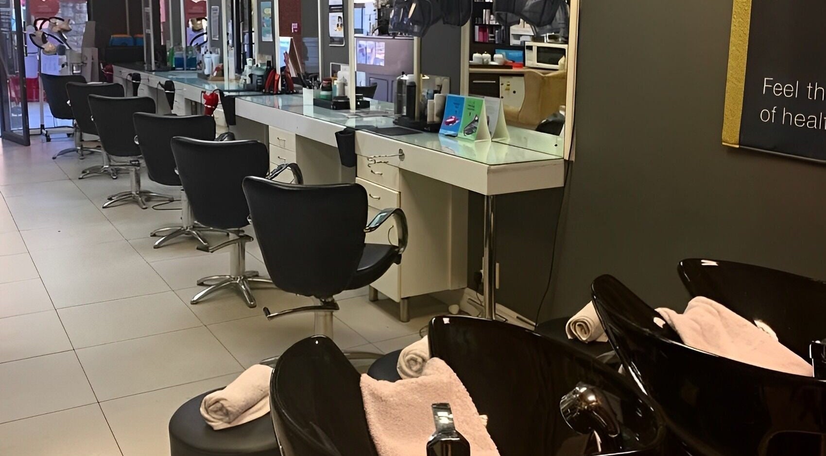 Chic interior of Arriba Salon in Cape Town, Western Cape, ZA. Elegant styling chairs and stations.