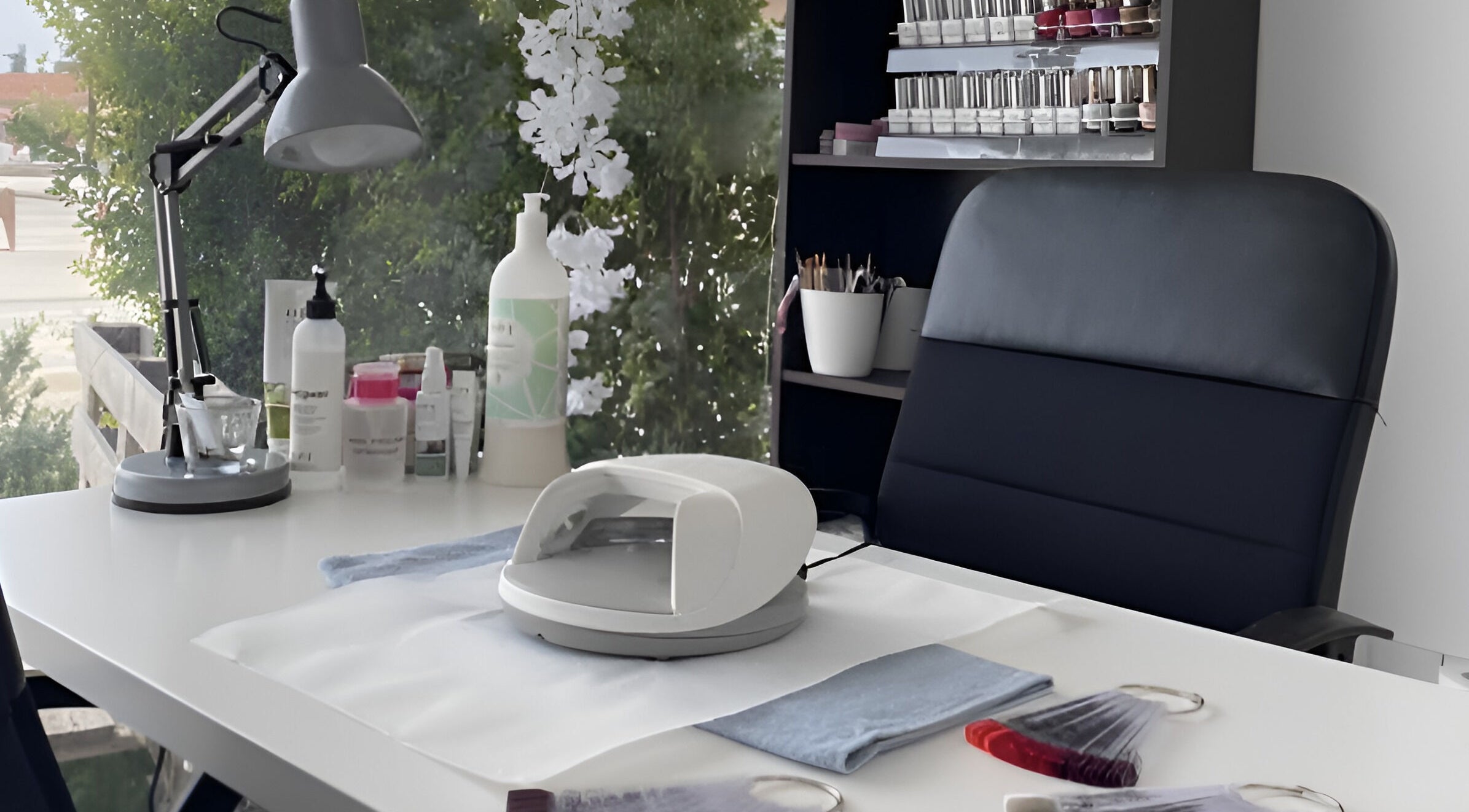 Elegant nail desk at The Cutting Room, Mandria, Paphos, CY, featuring manicure tools and polishes.