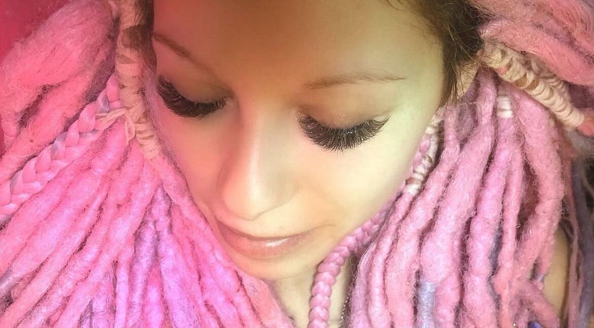 Vibrant pink dreadlocks and lush lashes at In Your Face Glamour, Edmonton, Alberta, CA.