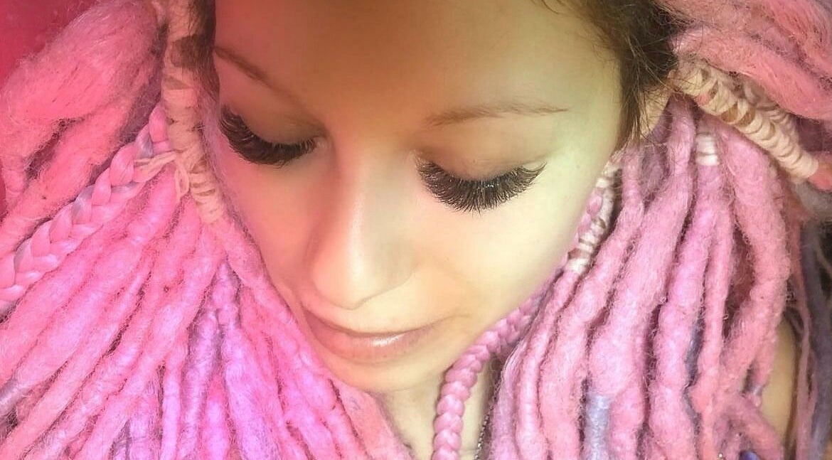 Vibrant pink dreadlocks and lush lashes at In Your Face Glamour, Edmonton, Alberta, CA.