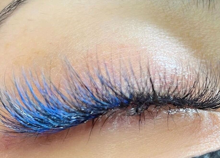 Blue-tinted eyelash extensions at In Your Face Glamour, Edmonton, Alberta, CA.