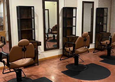 Stylish hair salon at Nova Beauty Boutique by Lupita Benavente in Santa Fe, New Mexico, US with elegant chairs.