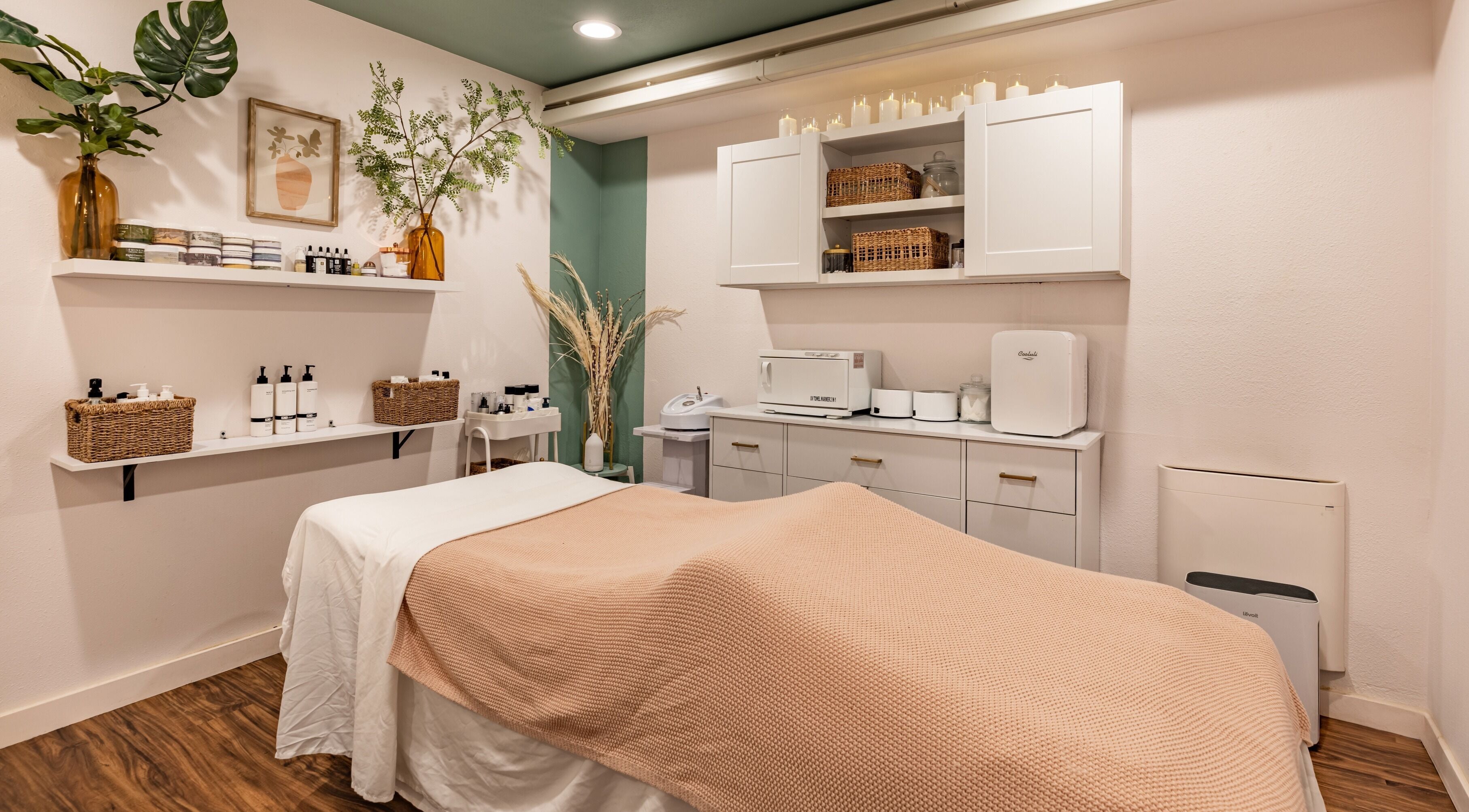 Relaxing treatment room at Babyface Beauty and Skincare, Seattle, Washington, US, with elegant decor and essentials.