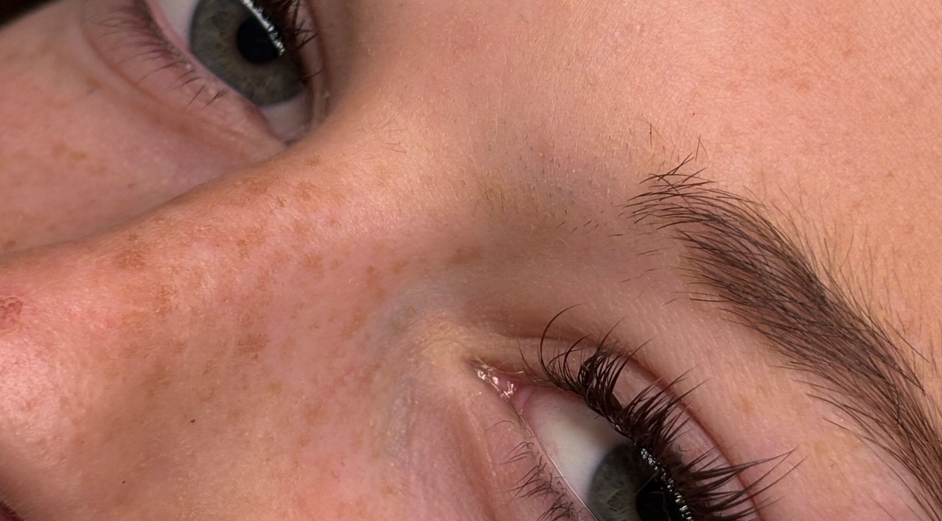 Close-up of groomed eyebrows and lashes at Lil Grace Beauty, Melbourne, Victoria, AU.