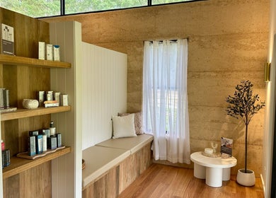 Cozy corner with seating at Divine Beauty House, Charlotte Bay, New South Wales, AU.
