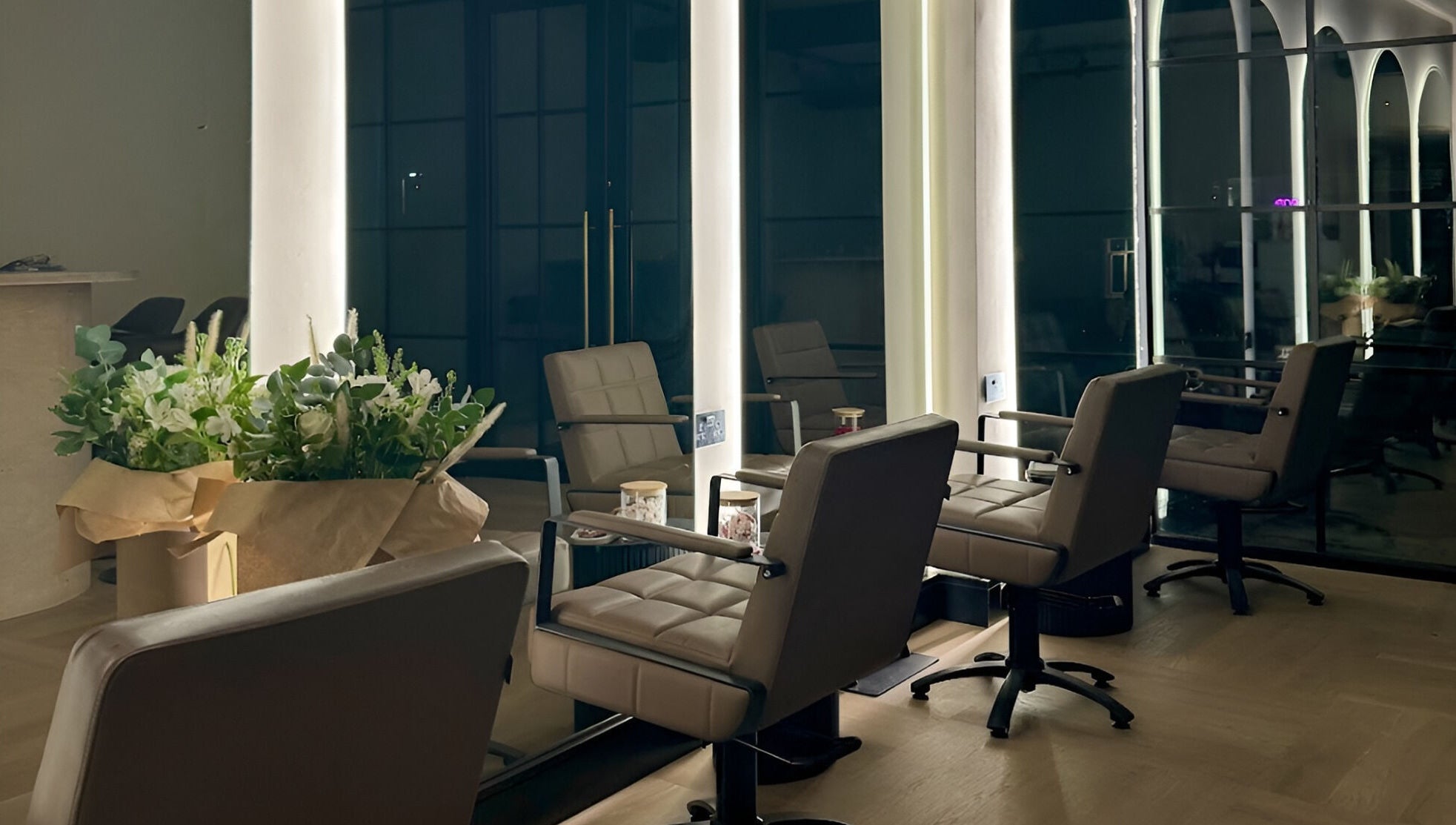 Chic salon interior at Signature Skin in Swinton, England, GB, featuring stylish seating and ambient lighting.