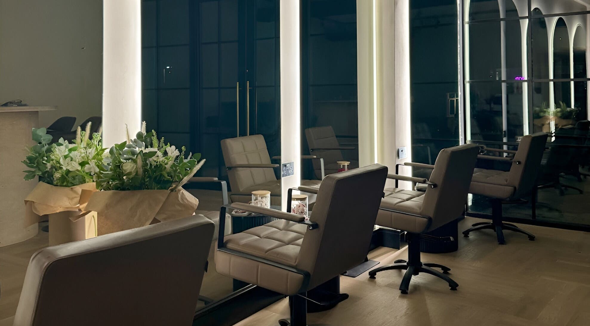 Chic salon interior at Signature Skin in Swinton, England, GB, featuring stylish seating and ambient lighting.