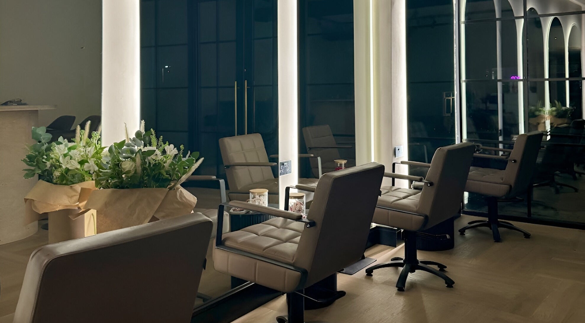 Chic salon interior at Signature Skin in Swinton, England, GB, featuring stylish seating and ambient lighting.