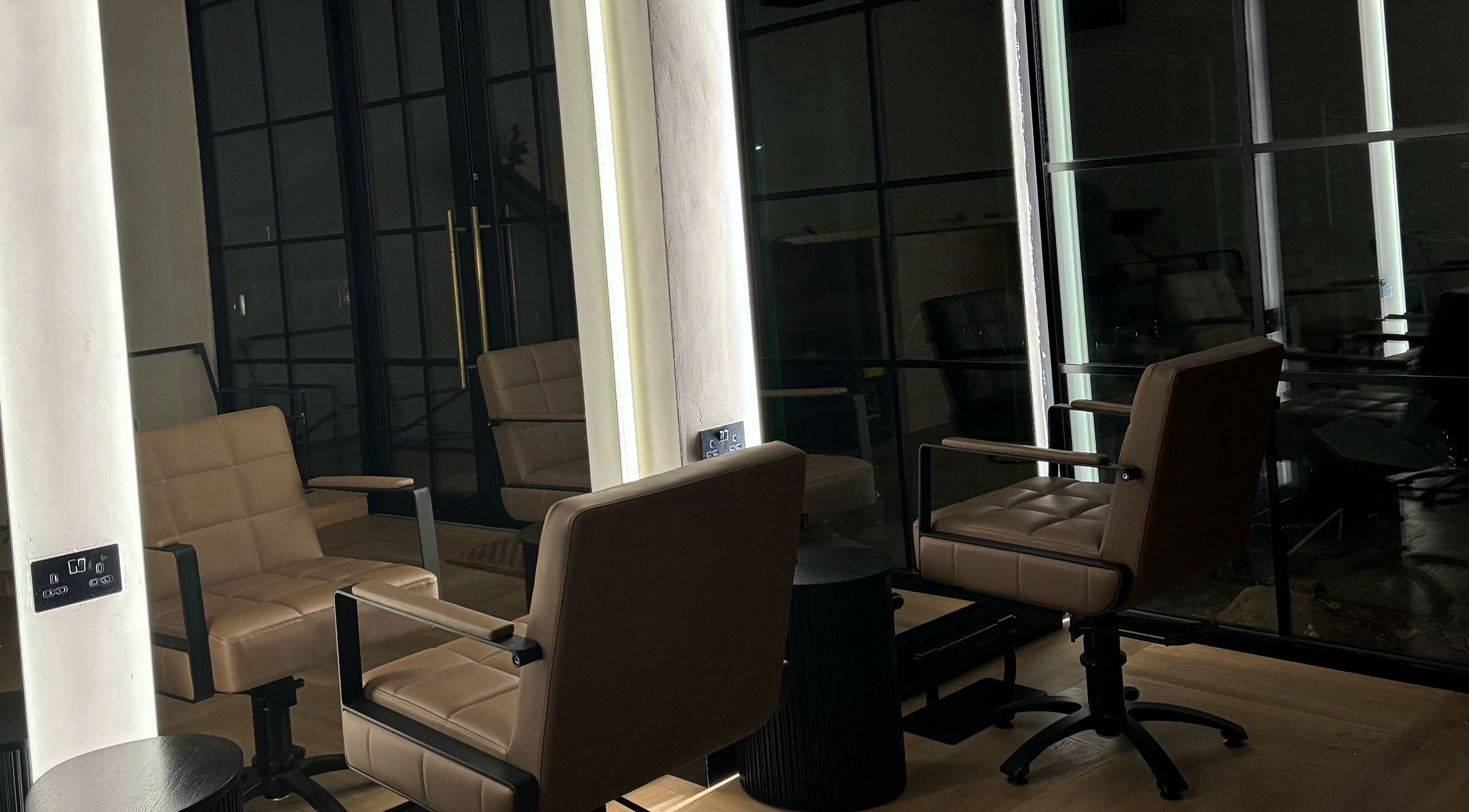 Chic salon chairs and mirrors at Signature Skin, Swinton, England, GB, offering a relaxing atmosphere.