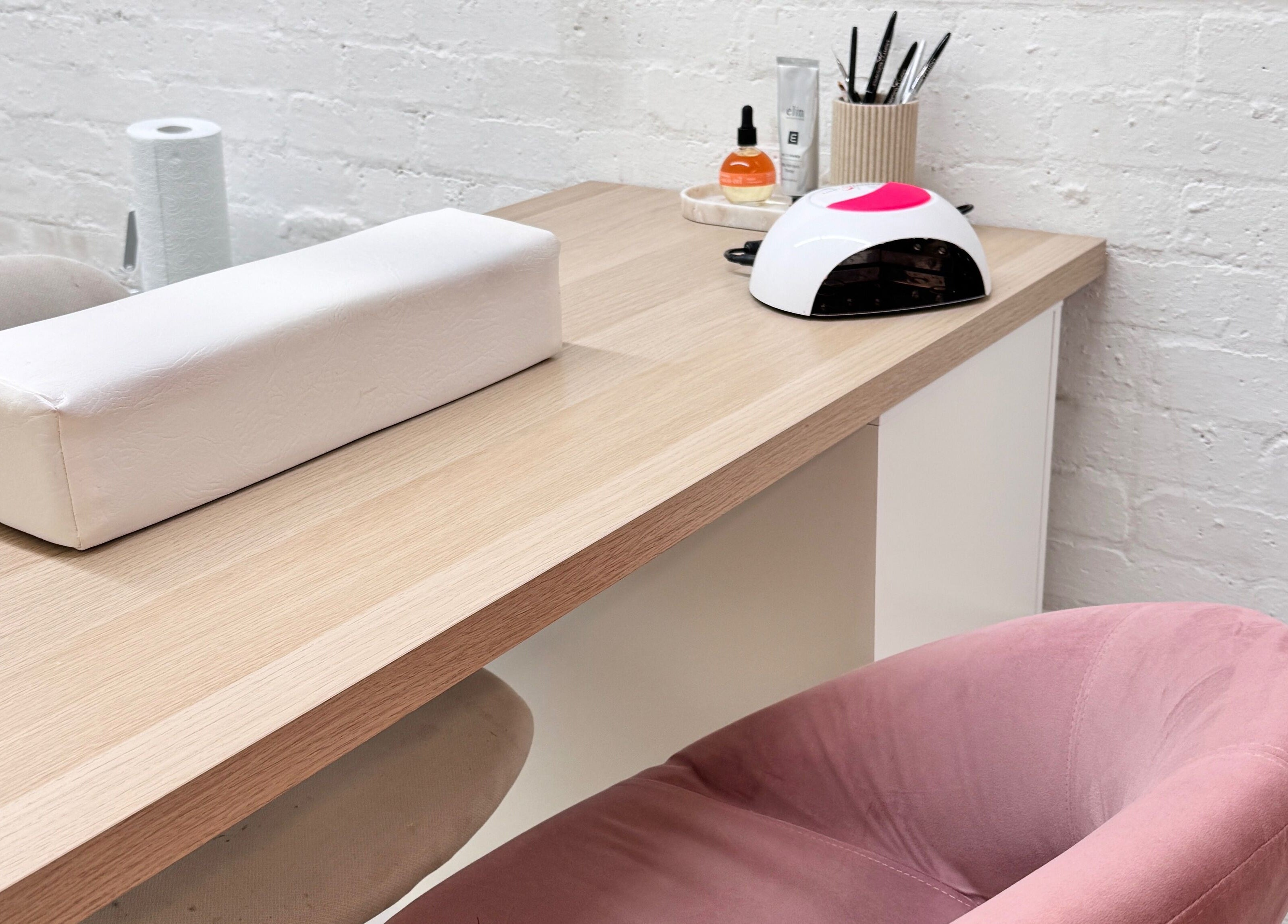 Nail station at ByJayleneFoster, Eccleshall, England, GB, featuring tools and a pink chair.