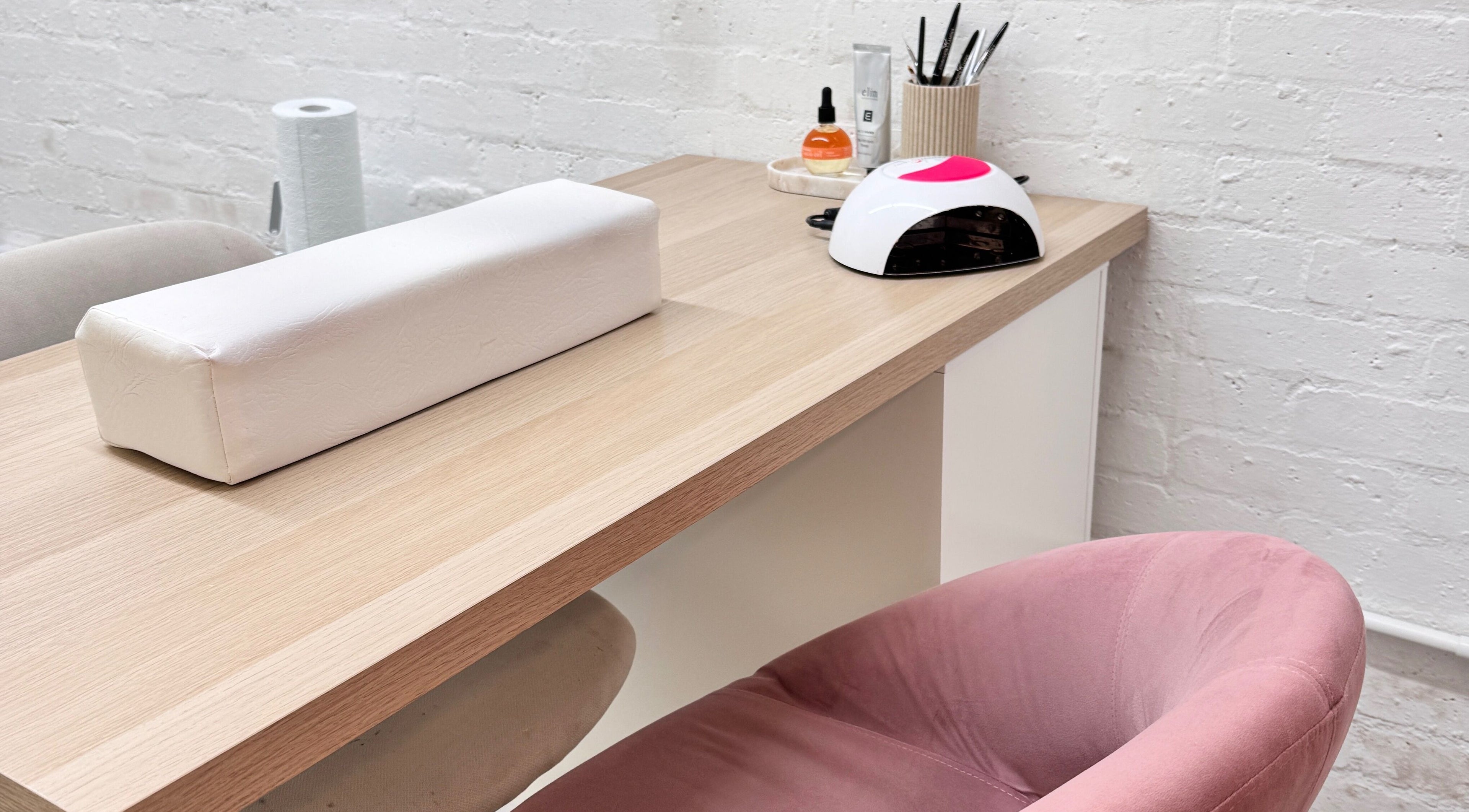 Nail station at ByJayleneFoster, Eccleshall, England, GB, featuring tools and a pink chair.