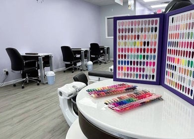 Nail polish selection at Violetta Beauty Studio, White Plains, New York, US, featuring vibrant colors.