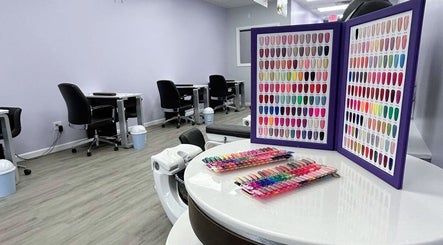 Nail polish selection at Violetta Beauty Studio, White Plains, New York, US, featuring vibrant colors.
