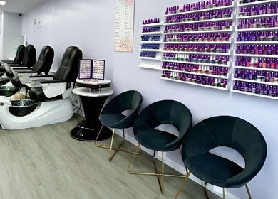 Modern pedicure chairs and nail polish display at Violetta Beauty Studio, White Plains, New York, US.