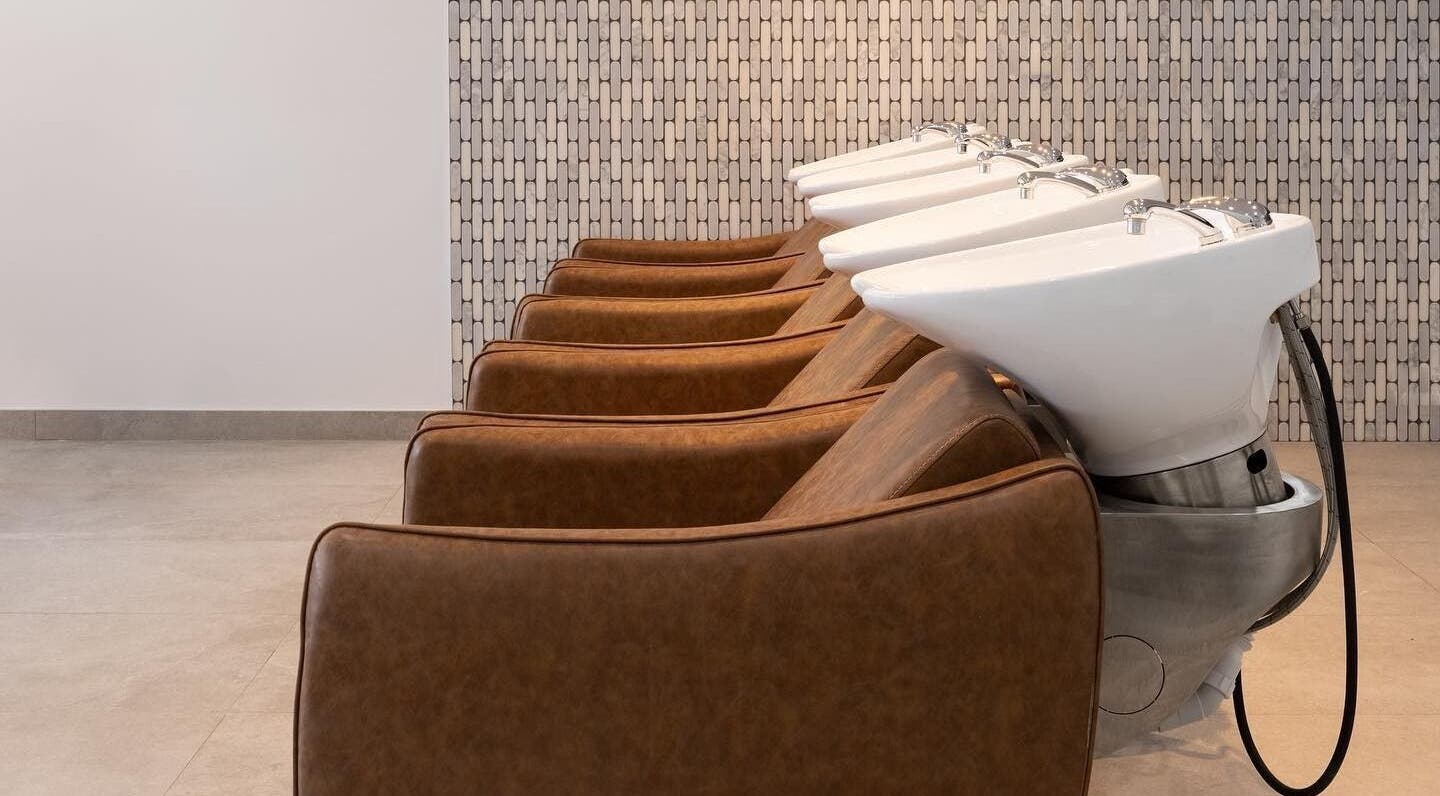 Luxurious washing stations at Mane Painters in Kingsgrove, NSW, AU, showcasing comfort and style.