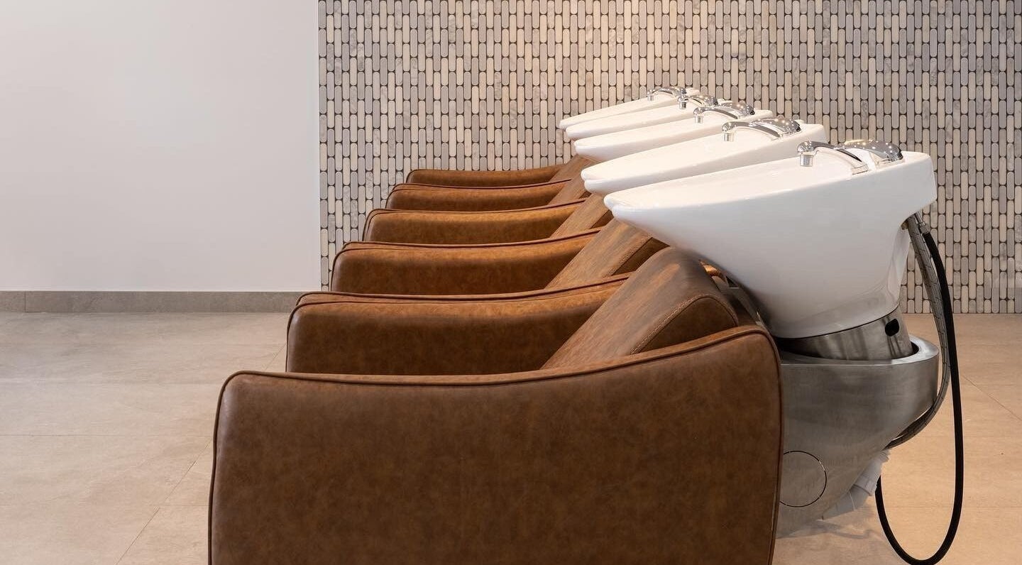 Luxurious washing stations at Mane Painters in Kingsgrove, NSW, AU, showcasing comfort and style.