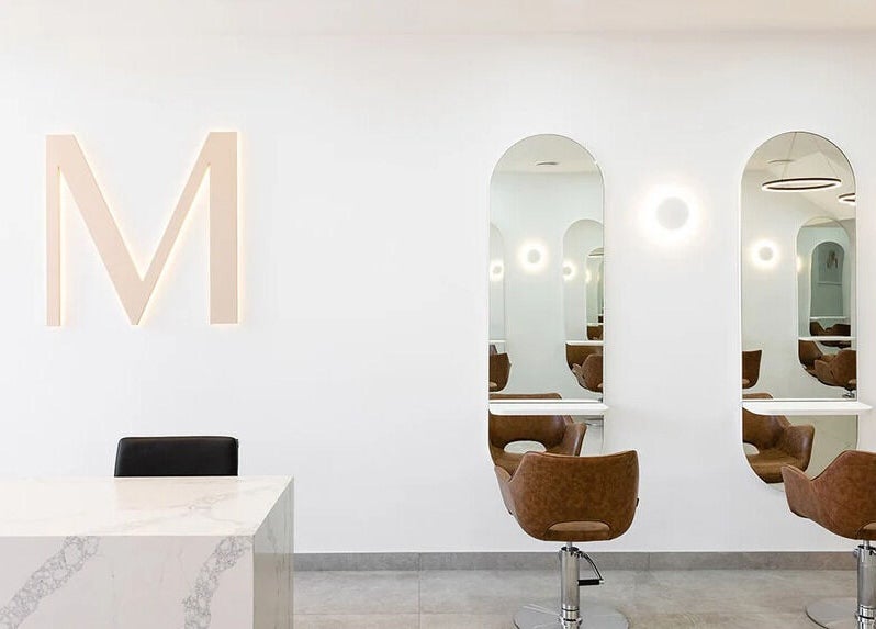 Modern salon interior with stylish chairs at Mane Painters, Kingsgrove, NSW, AU.