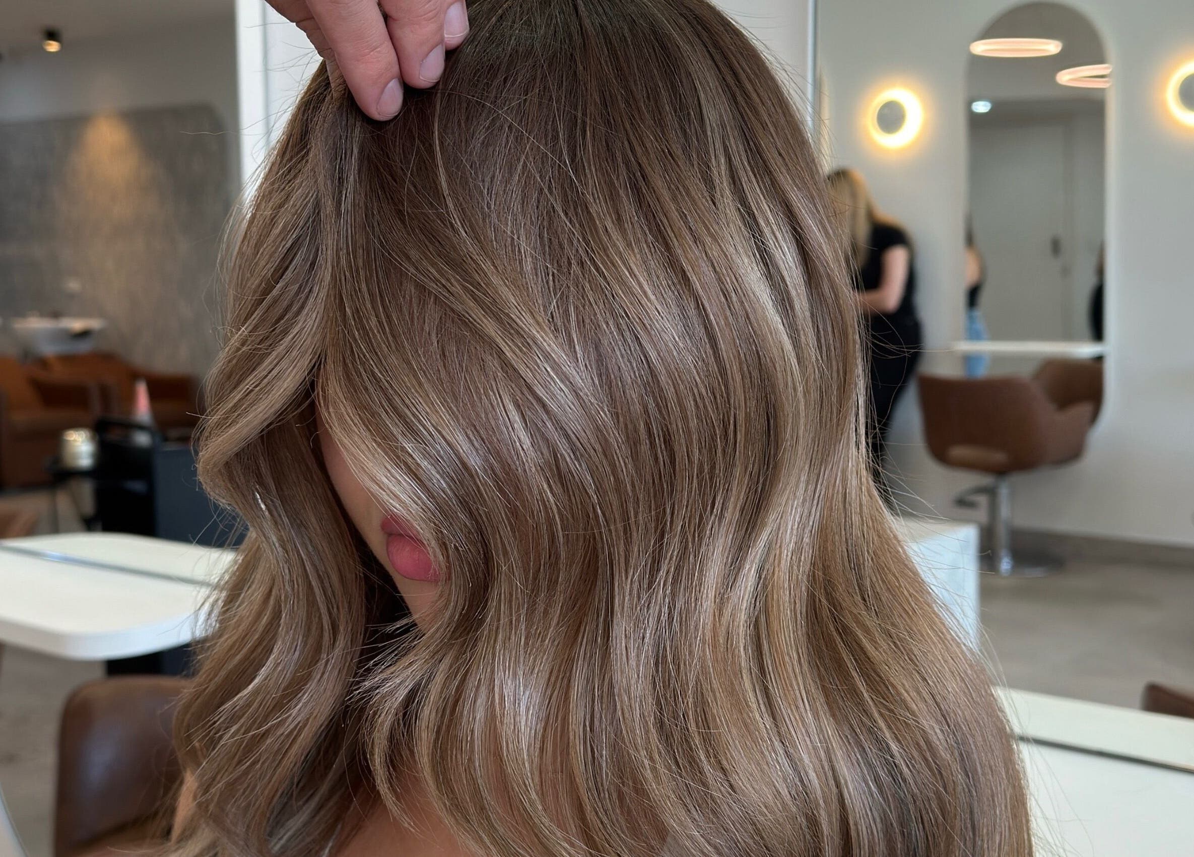 Elegant hair with soft highlights at Mane Painters, Kingsgrove, NSW, AU, in a chic salon setting.