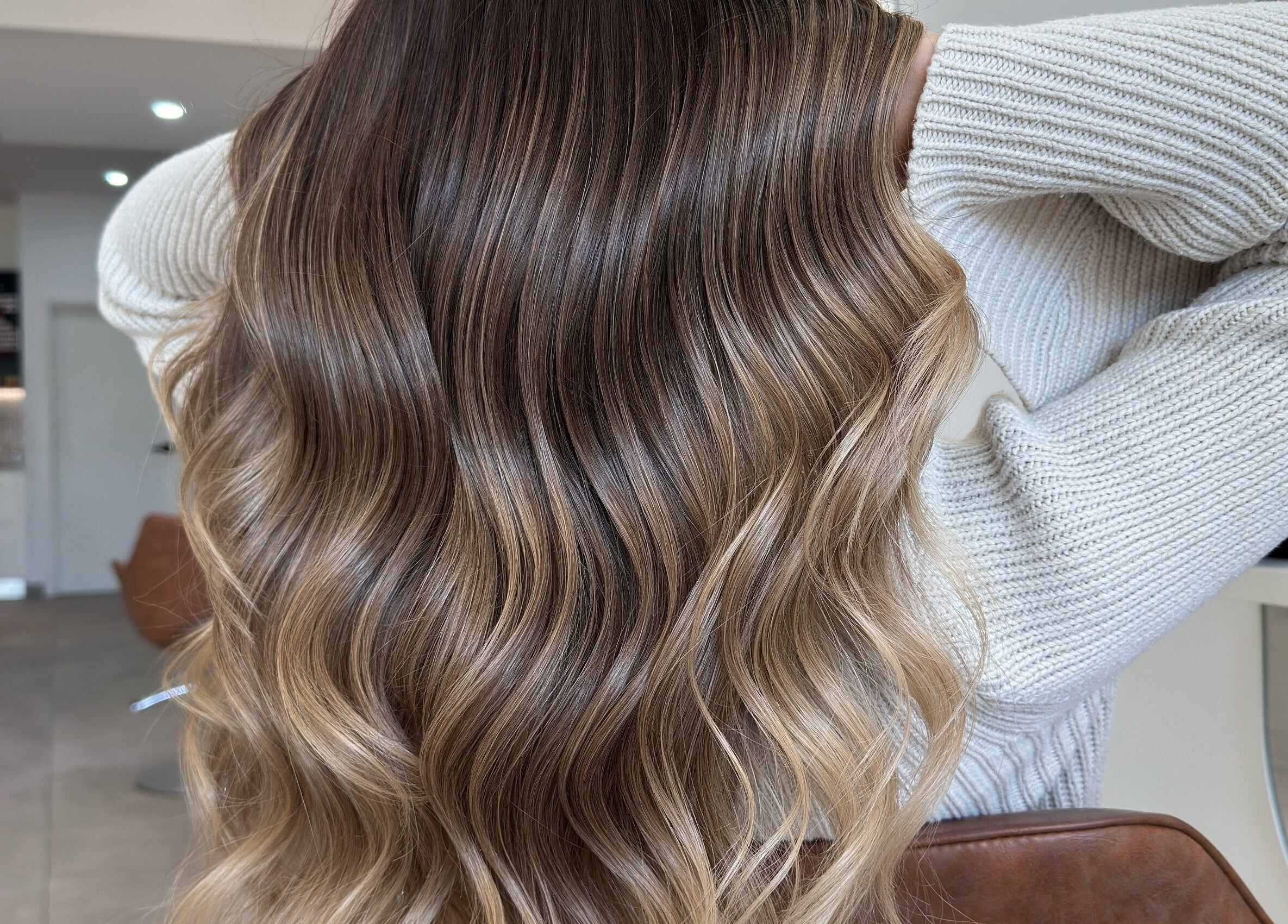 Luxurious wavy hair styled at Mane Painters, Kingsgrove, NSW, AU, showcasing expert salon craftsmanship.