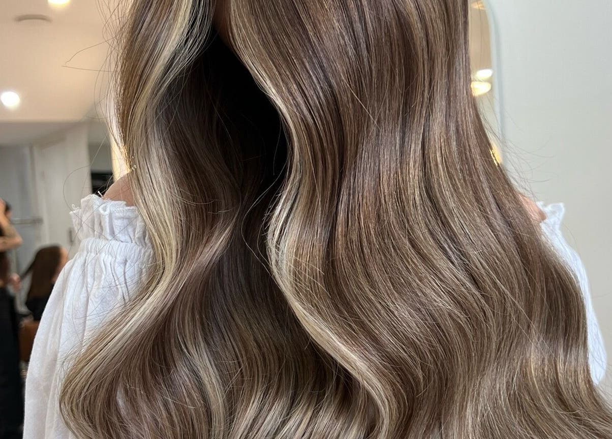 Beautifully styled wavy hair at Mane Painters, Kingsgrove, NSW, AU, showcasing expert salon care.