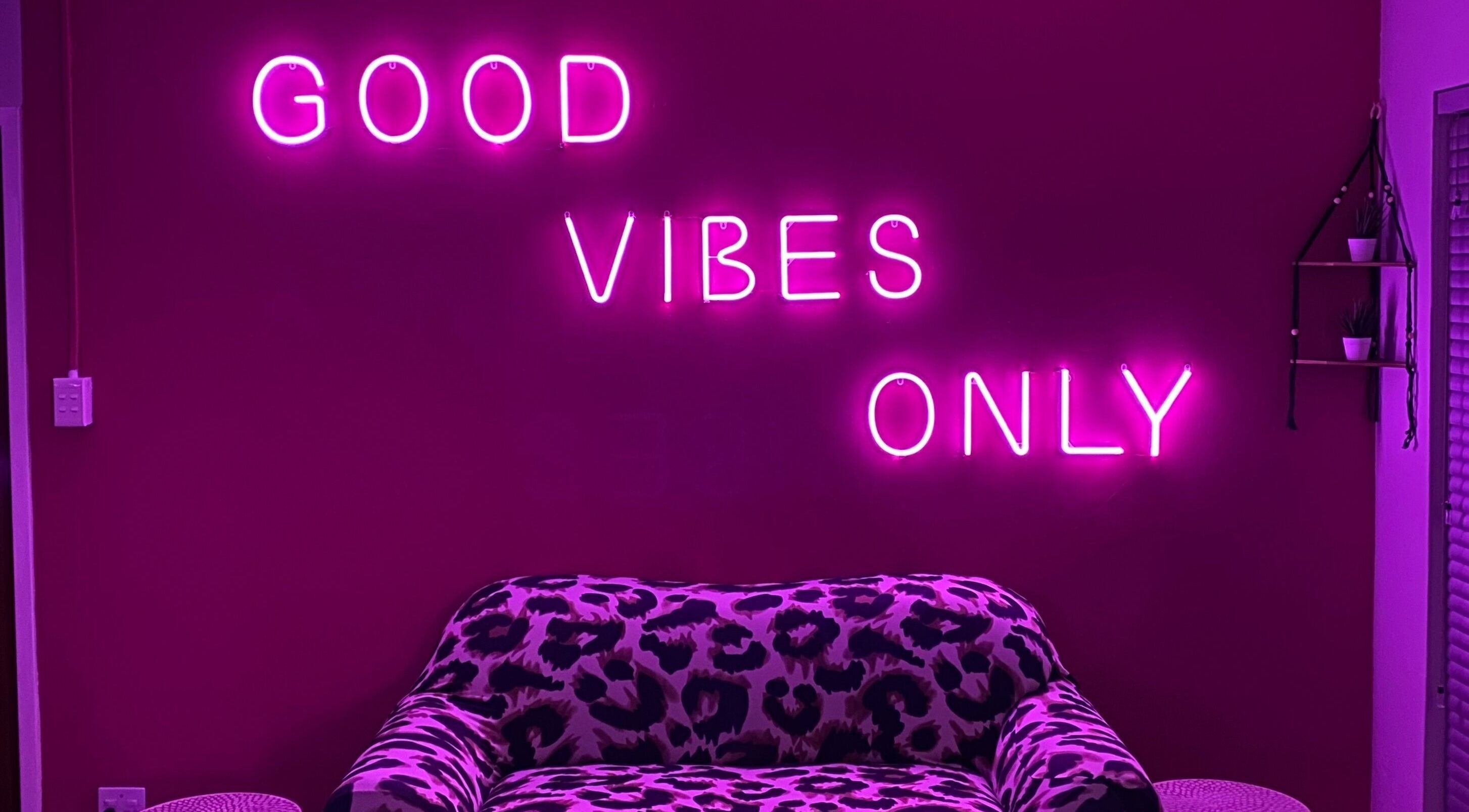 Stylish lounge with neon 'Good Vibes Only' at Xquisite Nails, Bloemfontein, Free State, ZA.