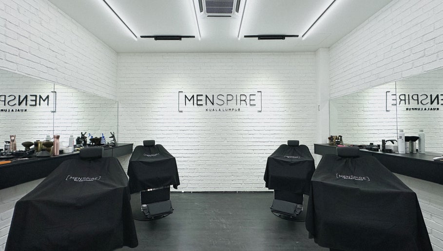 Modern interior of Menspire Kuala Lumpur with stylish barber chairs, located in KUALA LUMPUR, WILAYAH PERSEKUTUAN KUALA LUMPUR, MY.