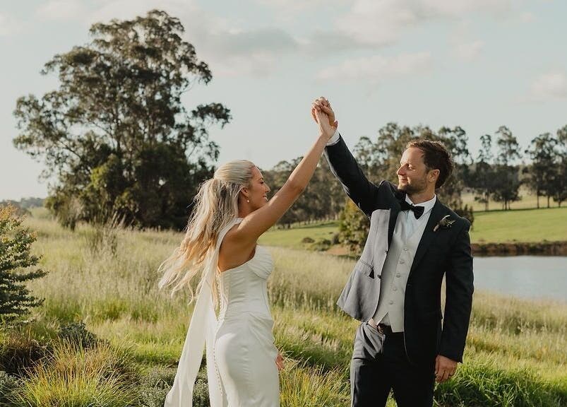 Couple dancing in a scenic field near Bronzed Body Spray Tan Studio, Port Kennedy, Western Australia, AU.