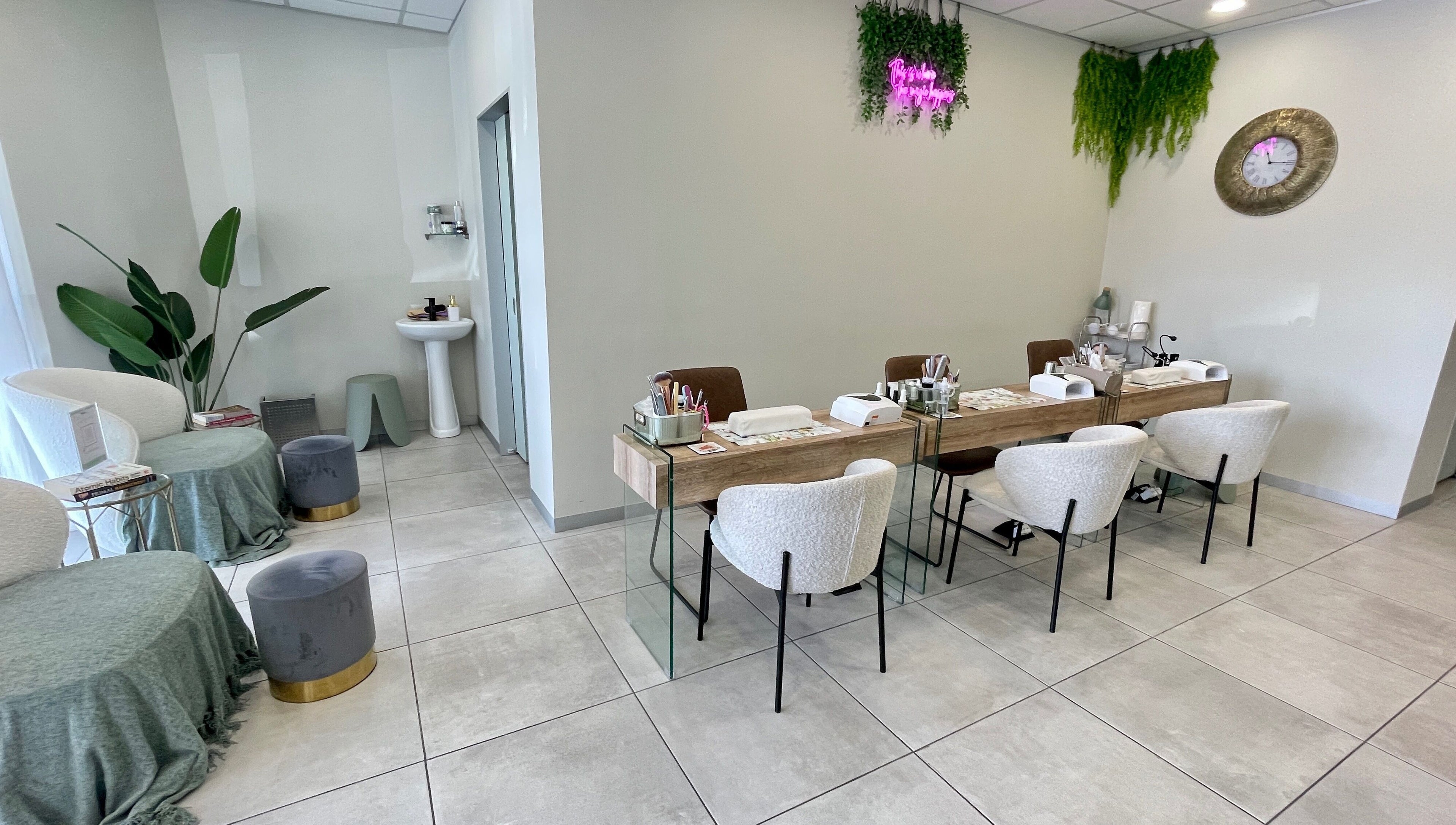 Modern beauty setup at KimCo Beauty Lab, Sandton, Gauteng, ZA. Elegant seating with manicure stations.