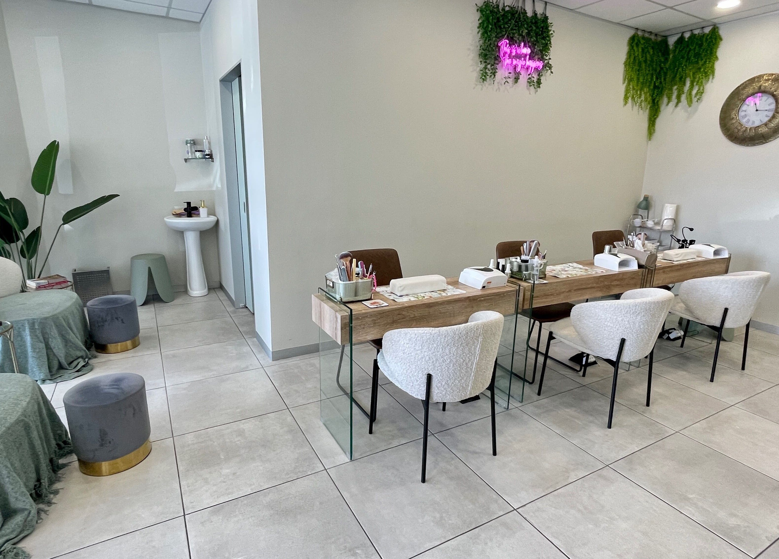 Modern beauty setup at KimCo Beauty Lab, Sandton, Gauteng, ZA. Elegant seating with manicure stations.