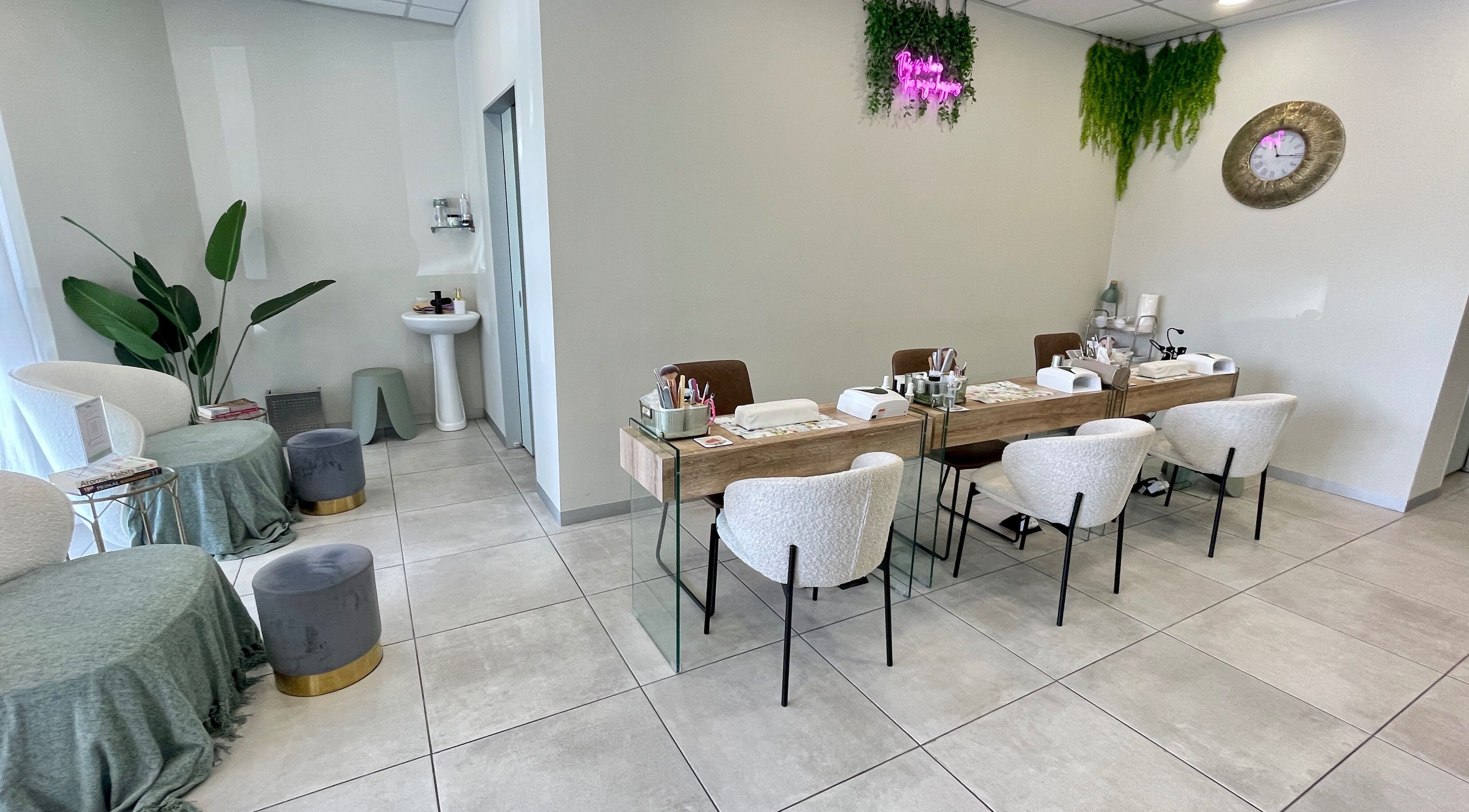 Modern beauty setup at KimCo Beauty Lab, Sandton, Gauteng, ZA. Elegant seating with manicure stations.