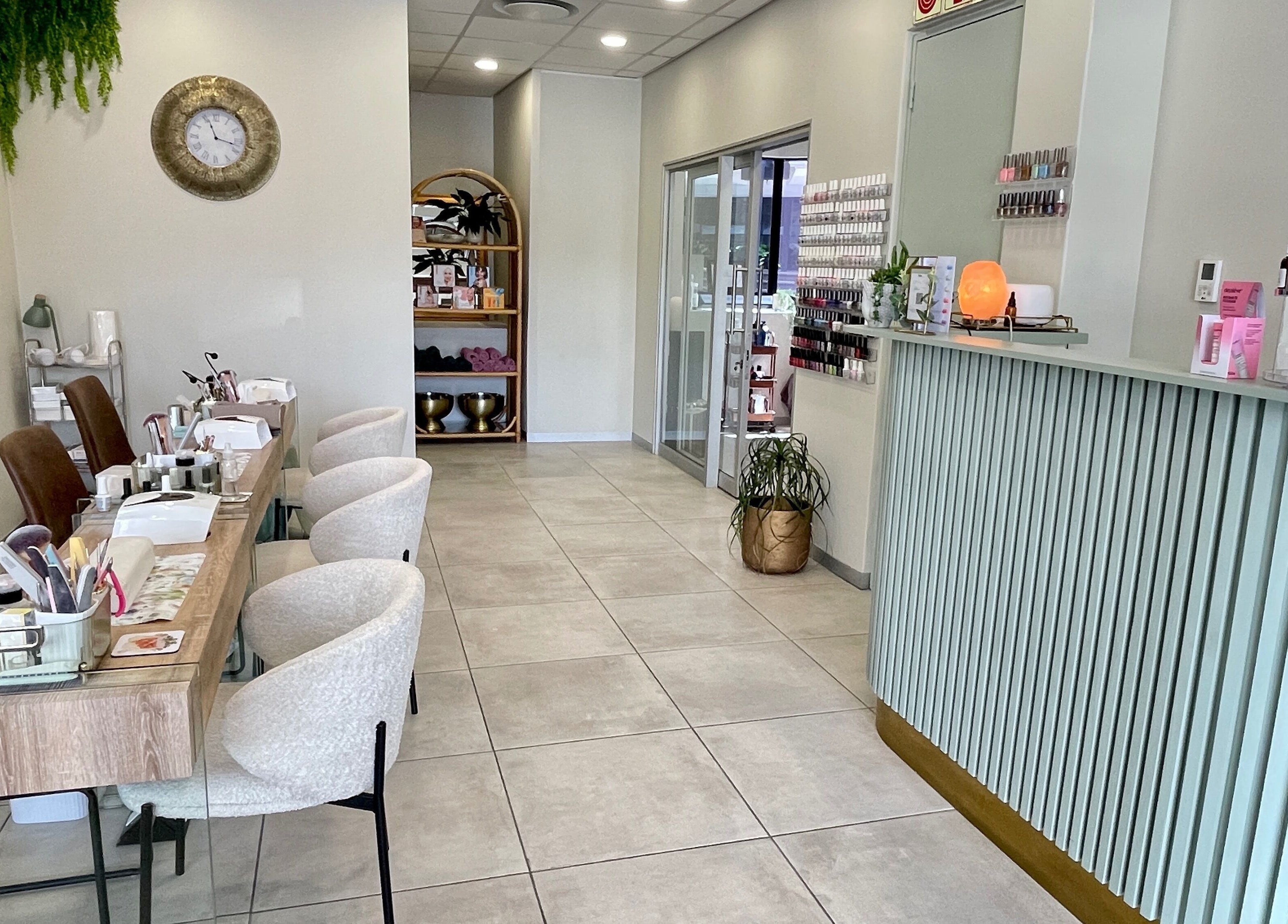 Interior of KimCo Beauty Lab in Sandton, Gauteng, ZA featuring a modern, inviting design with manicure stations.