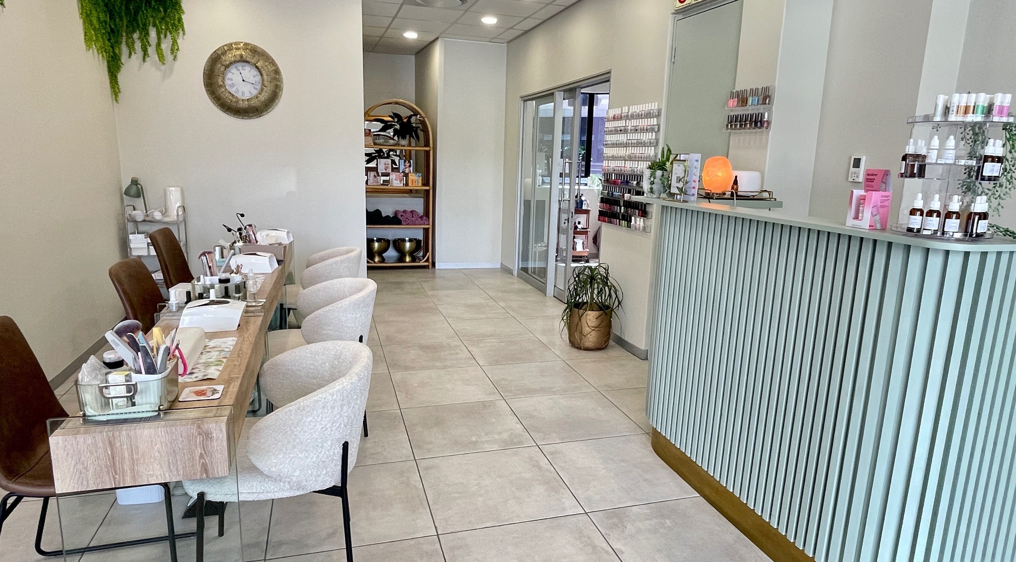 Interior of KimCo Beauty Lab in Sandton, Gauteng, ZA featuring a modern, inviting design with manicure stations.
