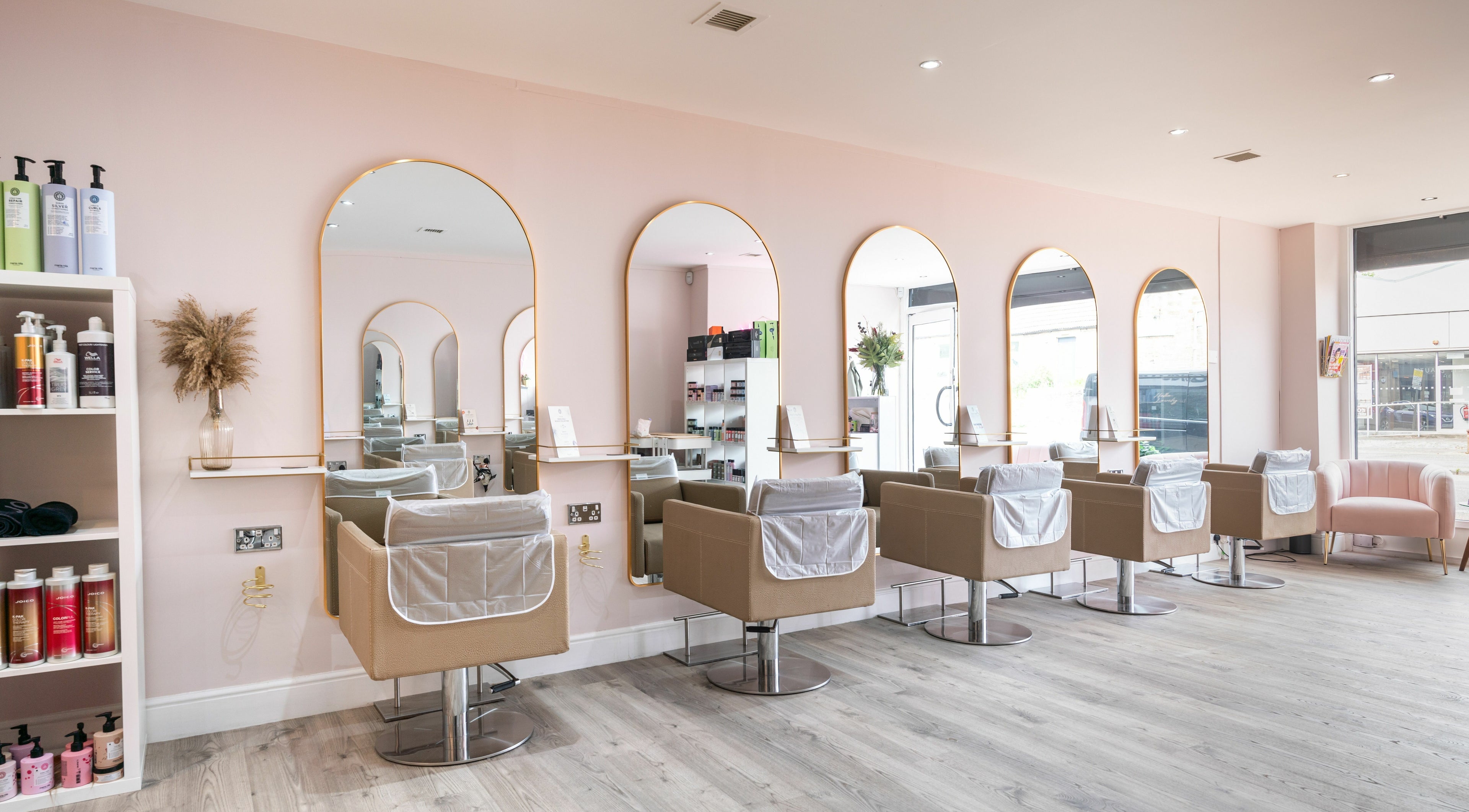 Pinkk Hair Design salon interior in Edinburgh, Scotland, GB with stylish mirrors and chairs.
