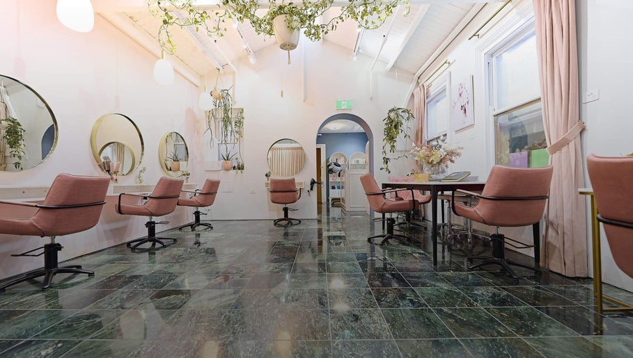 Elegant seating at Roshy Eyelash Extensions & Brows Norwest, Baulkham Hills, New South Wales, AU with pink chairs.