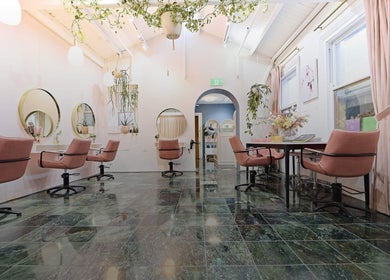 Elegant seating at Roshy Eyelash Extensions & Brows Norwest, Baulkham Hills, New South Wales, AU with pink chairs.